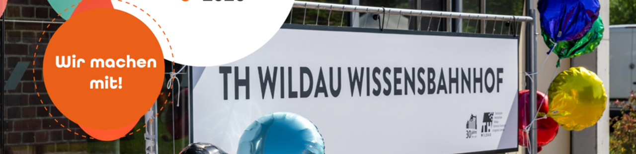 Schild mit Aufschrift "TH Wildau Wissensbahnhof"